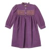 Girl violine in corduroy dress with smocks